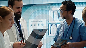 Physicians and radiologists analyzing x ray scans to create treatment plan