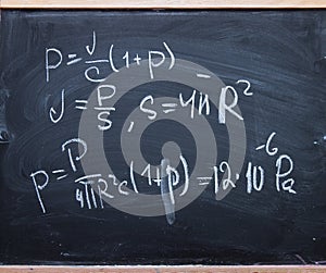 Physics formulas on blackboard