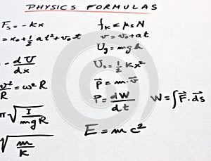 Physics formulas written on a white paper