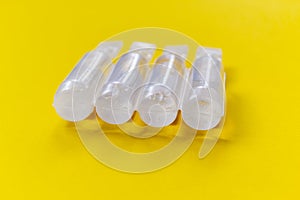 Physiological serum ampoules on a yellow background