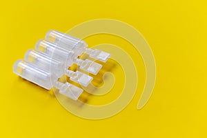 Physiological serum ampoules on a yellow background photo