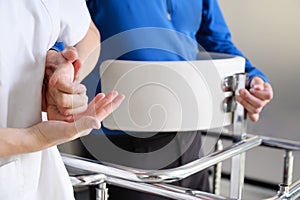 Physiotherapist assisting a patient with Amyotrophic Lateral Sclerosis.