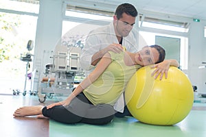 physiotherapist caring pregnant lady