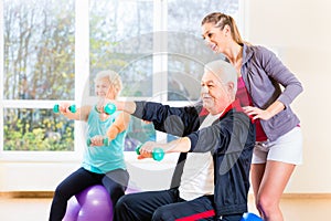 Physiotherapist coaching senior people