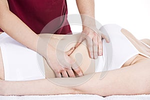 Physiotherapist doing a diaphragm massage to a woman patient photo