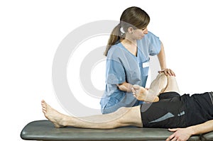 Physiotherapist doing a legs stretching of man patient. Osteopathy over white background.