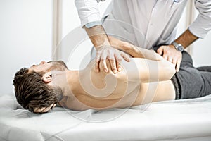 Physiotherapist doing manual treatment photo