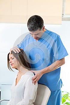 Physiotherapist doing myofascial therapy on woman patient