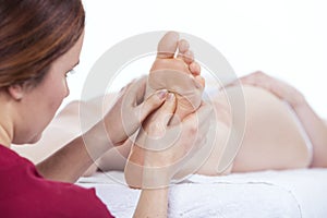 Physiotherapist doing plantar reflexology