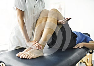 Physiotherapist doing treatment with patient in bright office