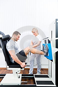 Physiotherapist exercising patient in sport therapy