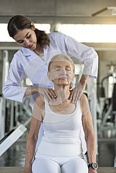 Physiotherapist helping old senior woman in physical center. elderly health lifestyle concept