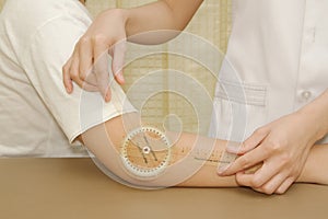 Physiotherapist measuring range of motion patients