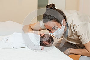 Physiotherapist performing pro-decubitus muscle stimulation on a newborn. photo
