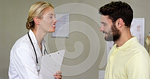 Physiotherapist shaking hands with patient