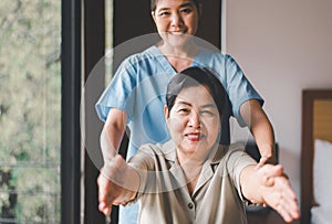 Physiotherapist training with elderly woman patient at home,Physical therapy concept
