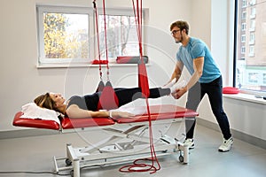 Physiotherapist uses an effective redcord in his work