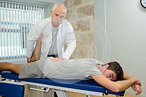 Physiotherapist working with patient in clinic