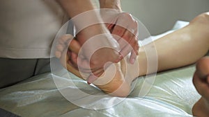 Physiotherapist working on a patient in a room