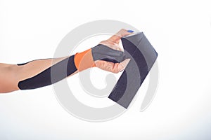 Physiotherapy for a diseased wrist. Alternative medicine. Adhesive tape for athletes with injuries. Support for an