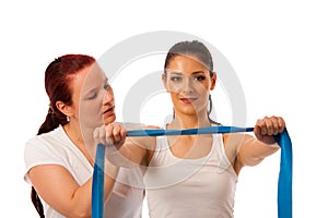 Physiotherapy - therapist doing arm strenghteninh excercises wit