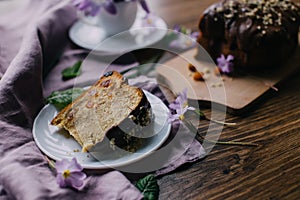 Piace of cake with flowers around and coffee photo