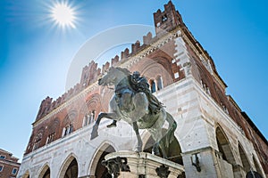 Piacenza, medieval town, Italy. Piazza Cavalli, equestrian monument and palazzo Gotico in the city center