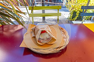 Piada sandwitch in a basket on a table