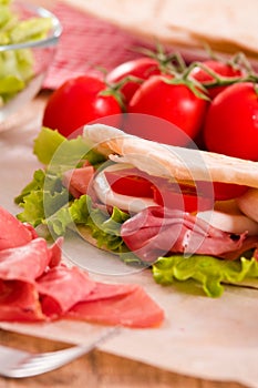 Piadina with ham and lettuce.