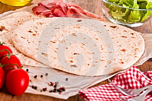 Piadina with ham and lettuce.