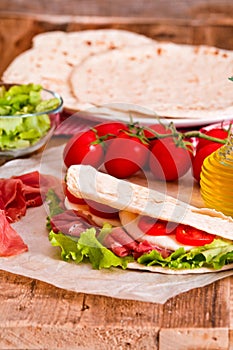 Piadina with ham and lettuce.