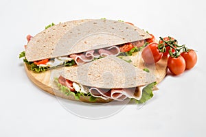 Piadina Romagnola stuffed with raw ham