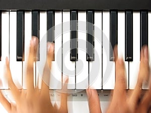 Pianist in action, playing a piano