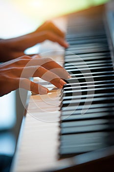 Pianist hands on the keyboard