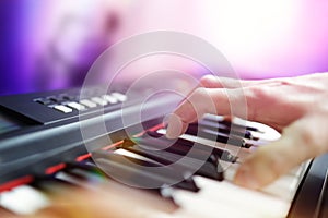 Pianist musician performing live playing keyboard in a band