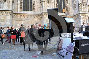 Pianist Paolo Zanarella gives free music street show playing his grand piano at the Duomo of Milan.