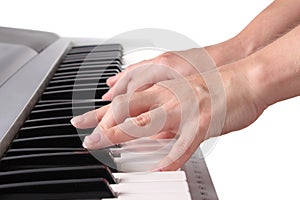Pianist's hand playing the piano