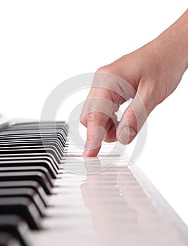 Pianist's hand playing the piano