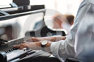 A pianist`s hands on the keyboard