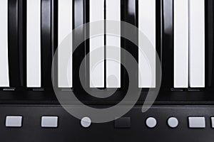 Piano or electronic synthesizer piano keyboard background Midi keyboard and controller with faders and buttons. Concept of close