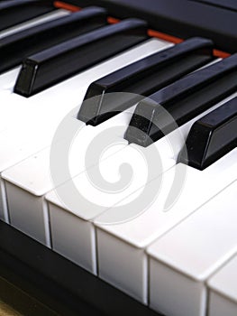 The piano keyboard with black and white keys and notes. Music and sound. photo