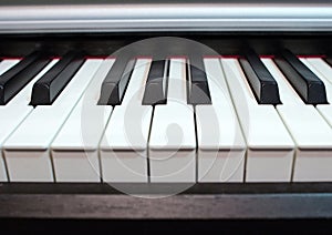 Piano keyboard close up. Elements of musical instrument.