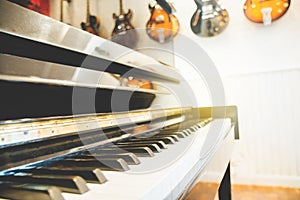 Piano keyboard with guitar back ground