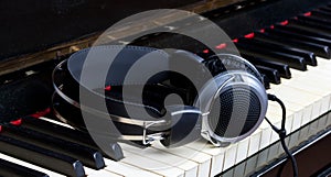 Piano keyboard and headphones