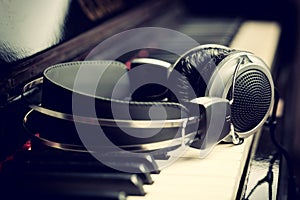 Piano keyboard and headphones