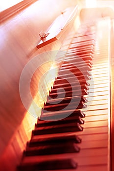 Piano keyboard illuminated by the sun