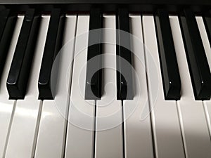 Piano keyboard keys close-up one octave photo