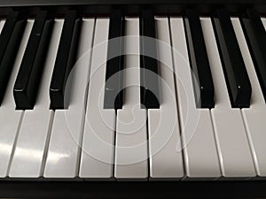 Piano keyboard keys close-up one octave photo