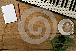 Piano keyboard on old wood desk