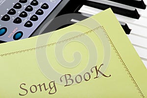 Piano keyboard with song book